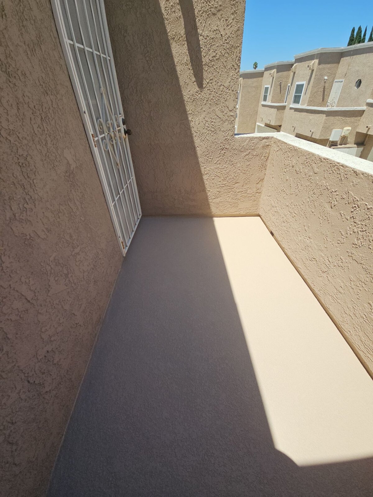 After waterproofing: completed beige AL-Flex waterproof balcony surface