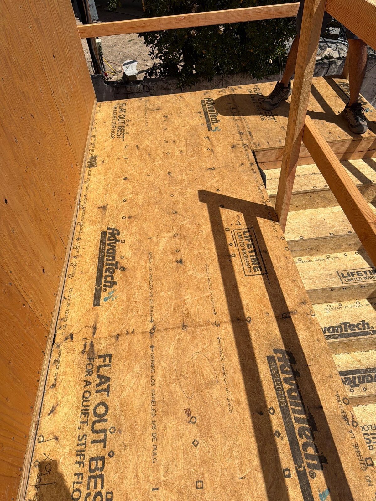 Before waterproofing: newly installed wood-sheathed walkway, landing and staircase substrate