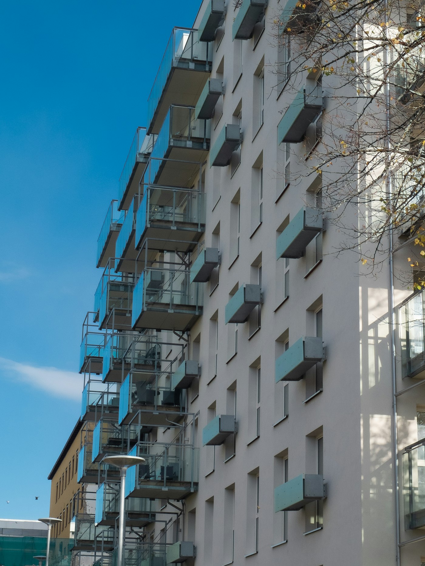 Apartment building with exterior glass balconies