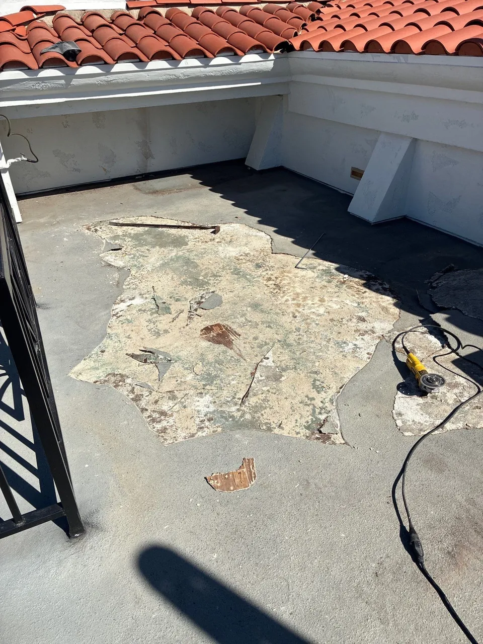 Before waterproofing: old rooftop deck surface during removal in Hermosa Beach, California